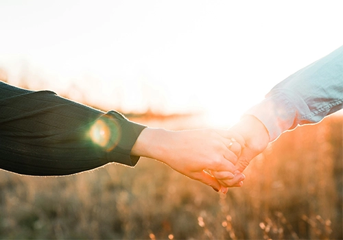Couple holding hands